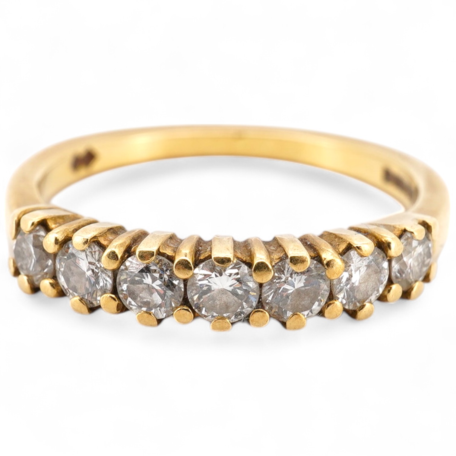 A modern 18ct gold and seven stone diamond set half hoop ring size O, gross weight 3.2 grams.